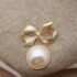 Elegant Vintage Brooch Collection featuring Baroque Pearl Bow Designs (1)