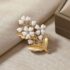 Elegant white matte gold flower brooch with heart petal design