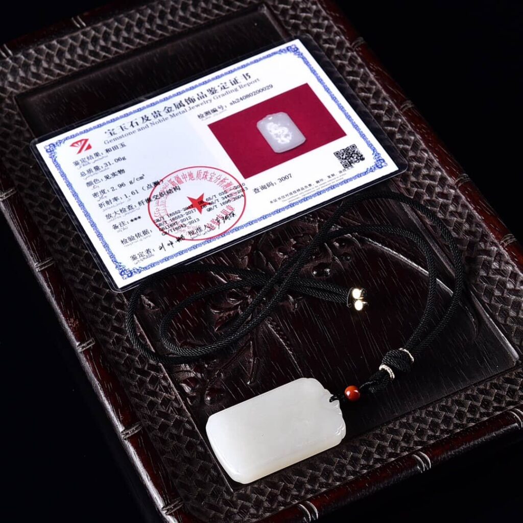 Authenticity certificate for Hotan Jade Dragon Phoenix Pendant, verifying natural jade origin and quality.