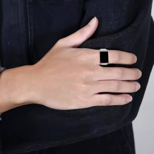 Man wearing Black Jadeite Cabochon Ring, illustrating a commanding presence.