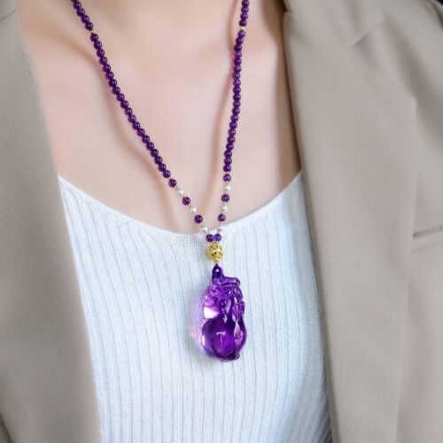Model wearing Amethyst Pixiu pendant necklace, illustrating powerful presence and elegant size.